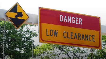 Highway sign: DANGER LOW CLEARANCE