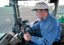 Man operating farm equipment