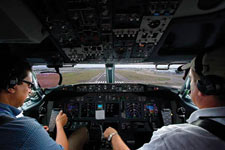 Cockpit view of pilots landing a plane