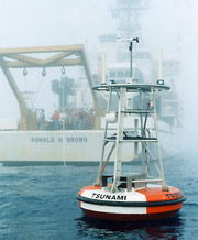 DART buoy at sea with NOAA ship in background