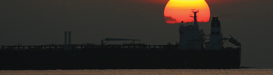 Container ship with sunset in background
