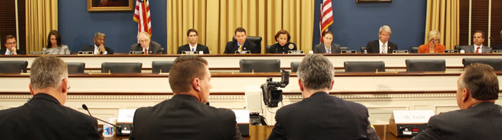 Members of Congress addressing witnesses at a hearing