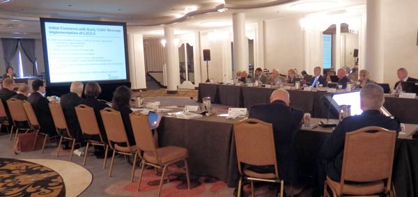 Advisory Board members seated at conference table and receiving a presentation