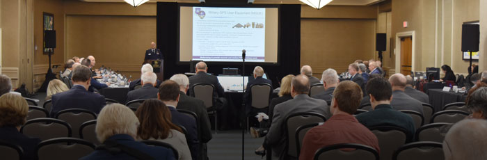 Air Force official presenting before the board members and public audience