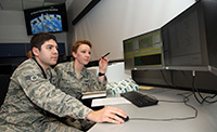 2SOPS officers at a workstation