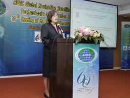 Woman giving presentation from podium