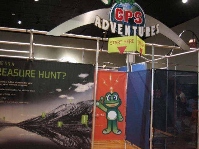 GPS adventures Start Here sign with an arrow pointing to the exhibit.