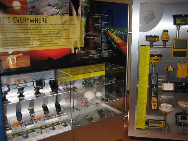 Various types of GPS user equipment in glass cabinets.
