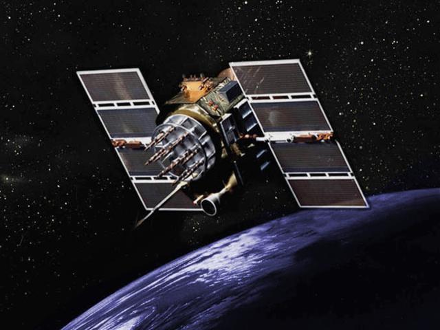 Illustration of the GPS Block II/IIA Satellite (Retired) in space with the Earth in the background.