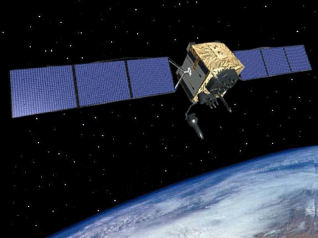 Satellite with starry backdrop and the curve of the earth in the low background.
