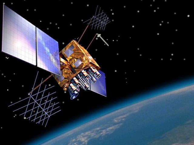 GPS Block IIR(M) satellite in space with the Earth in the background.