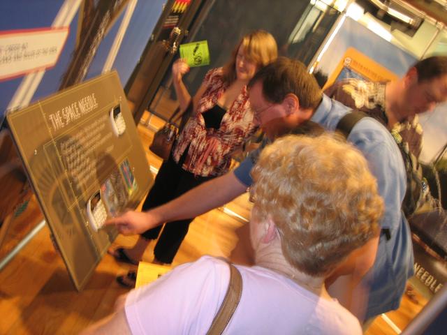 People gathered around a puzzle labeled The Space Needle